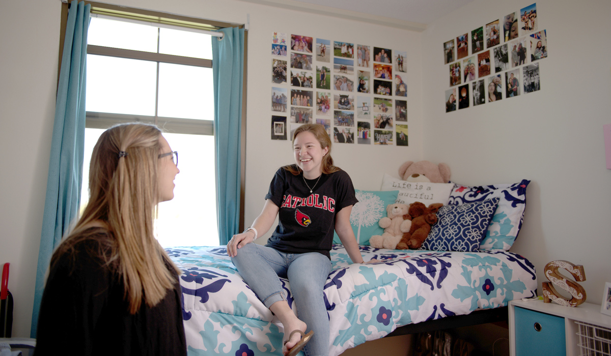 Two female students in residence hall room