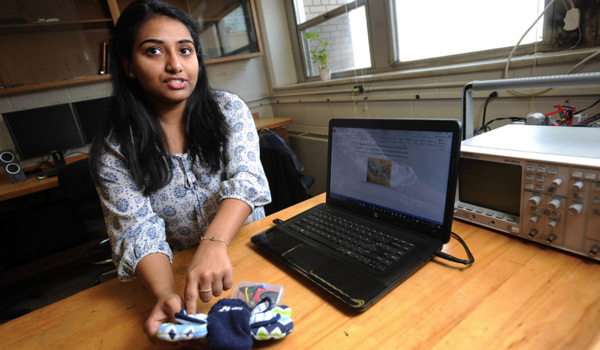 A biomedical engineering student working on her laptop.